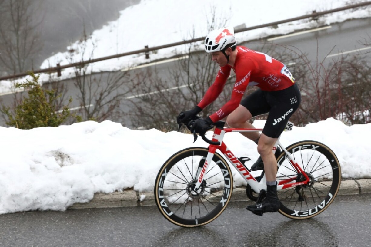 Swiss rider Mauro Schmid cycles through snow on Saturday's Paris-Nice stage