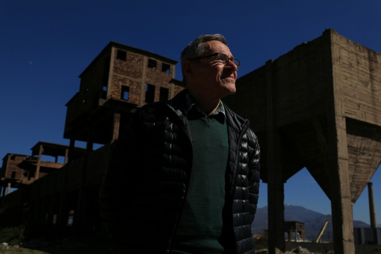 Environmental expert Ahmet Mehmeti in the ruins of Albania's communist-era steelworks in Elbasan