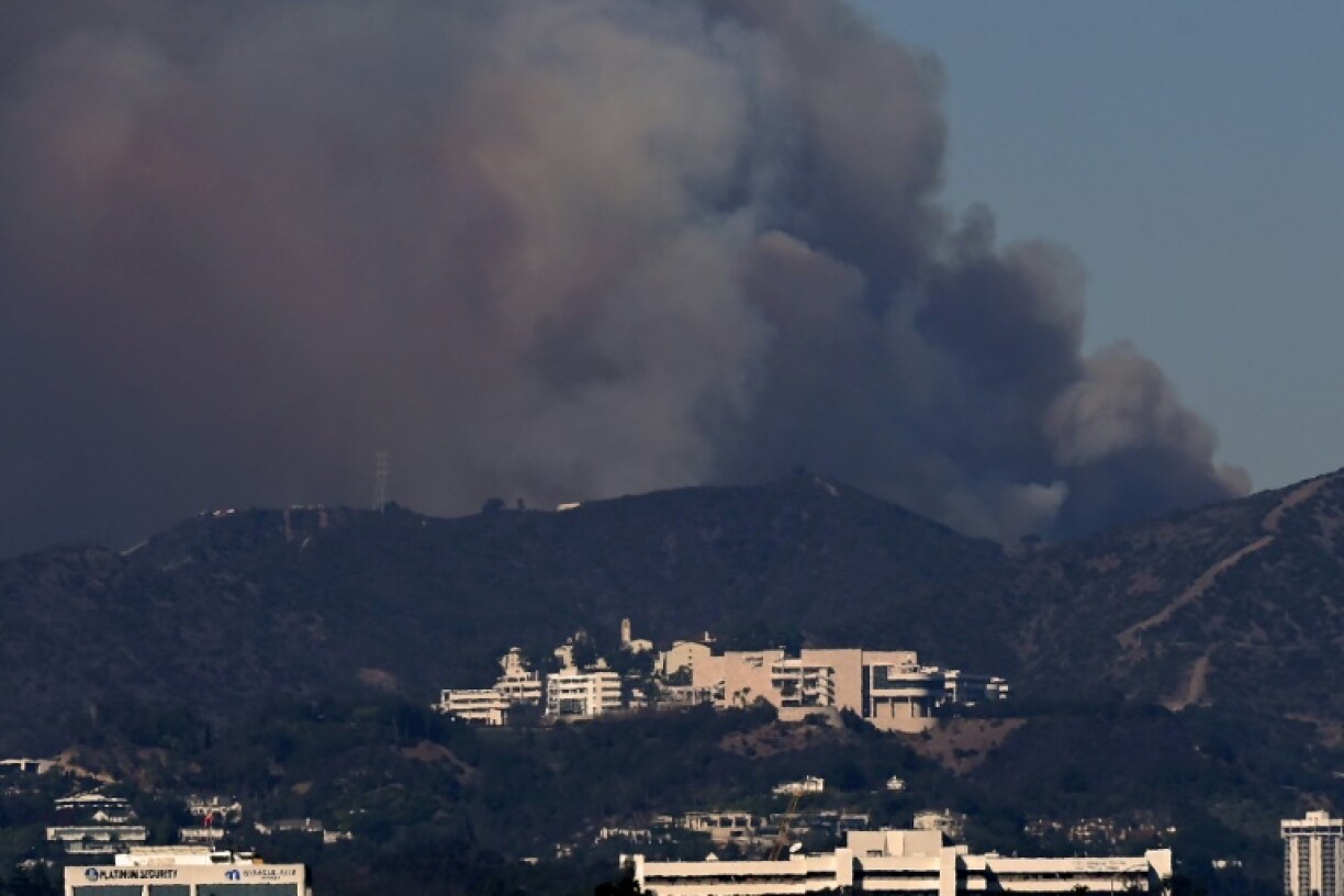 Smoke from the Palisades Fire rises over the Getty Museum