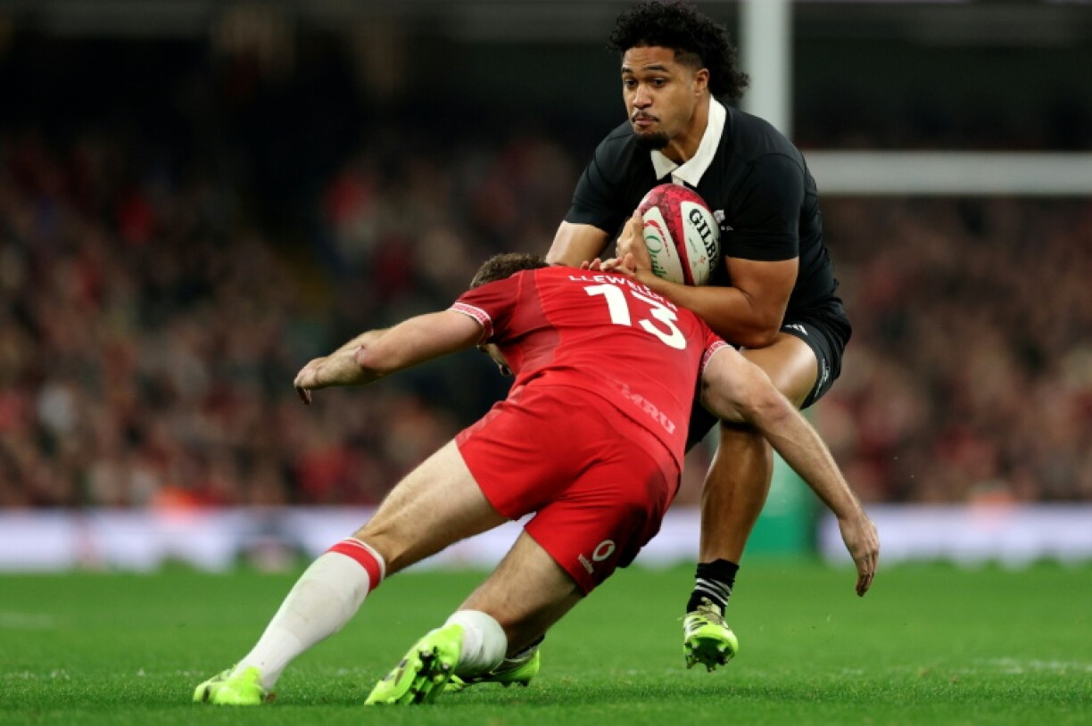 New Zealand's Leicester Fainga'anuku runs with the ball during the Autumn Nations Series International rugby union test match between Wales and New Zealand at the Principality Stadium, in Cardiff on November 22, 2025
