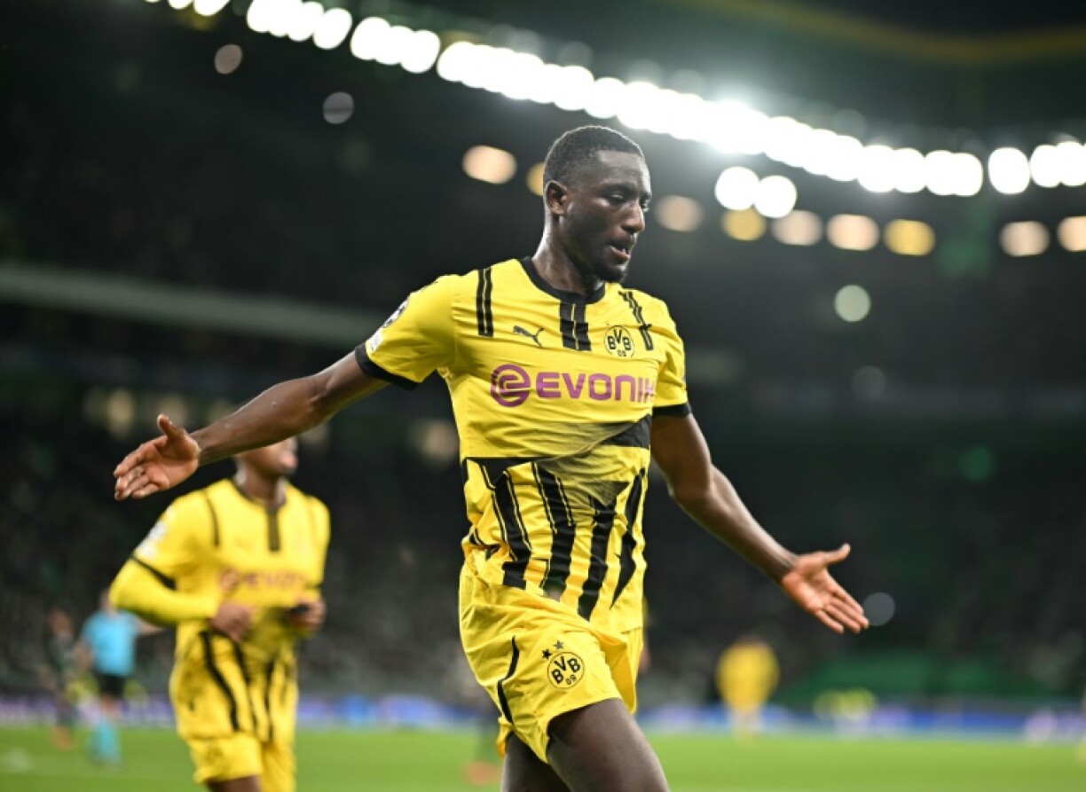 Borussia Dortmund's Guinean forward Sehrou Guirassy celebrates scoring his team's first goal at Sporting Lisbon