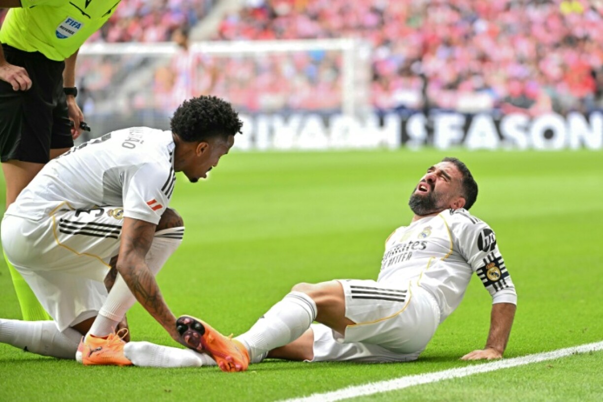 Real Madrid's Spanish defender Dani Carvajal is set to miss around a month with a calf injury and may not be able to face Barcelona in October