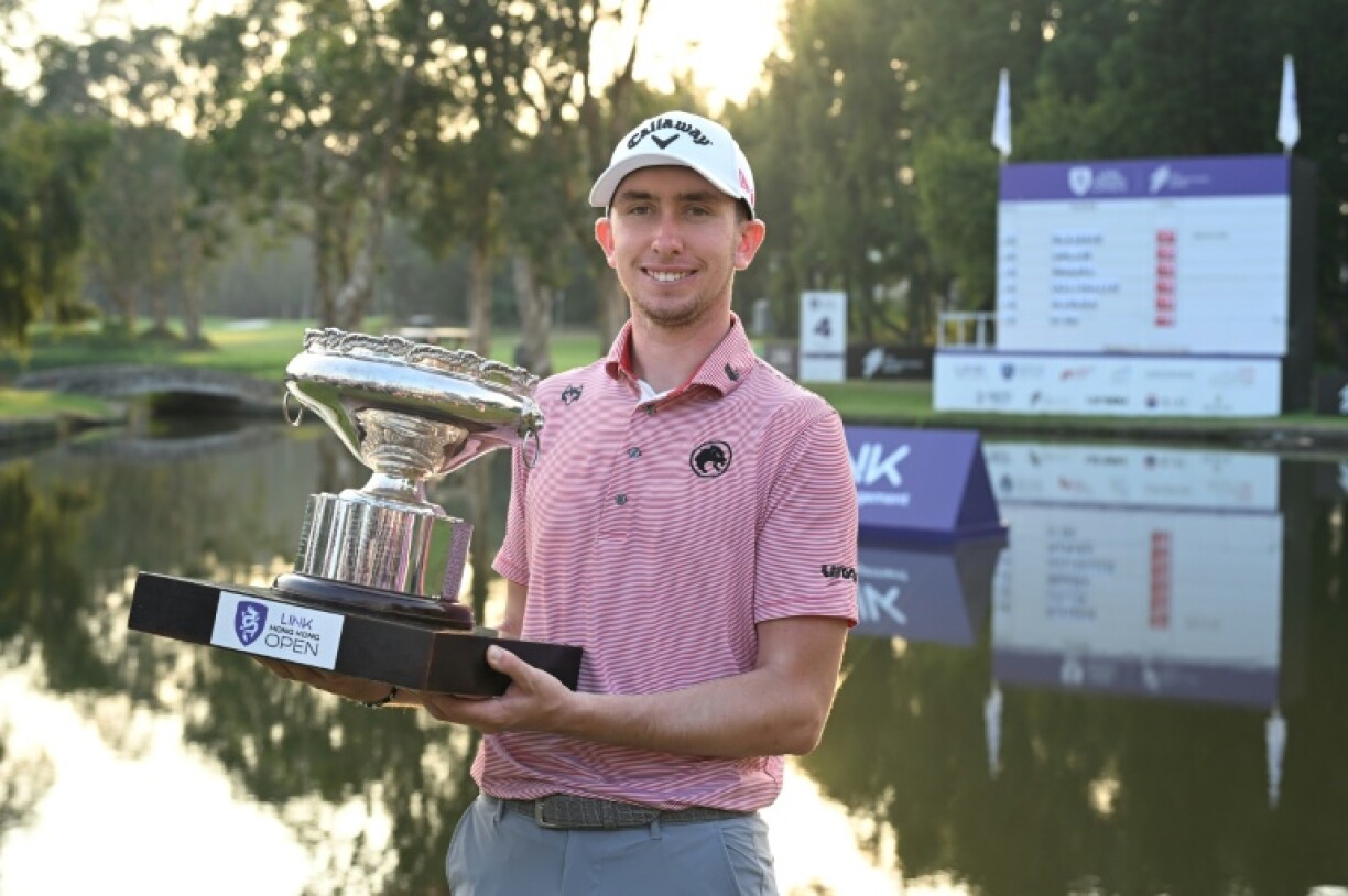 Northern Ireland's Tom McKibbin holds the trophy after winning the Hong Kong Open