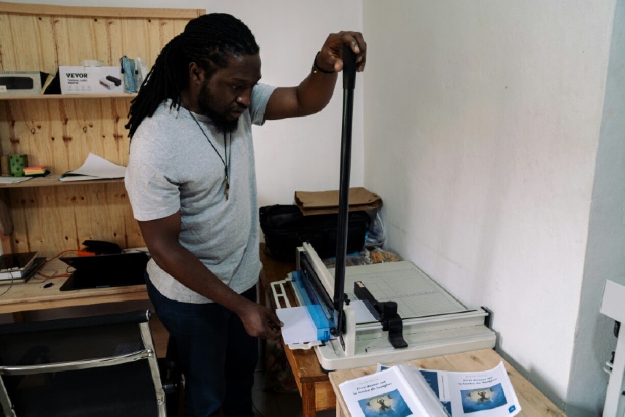 Printer Martin Lukongo overcomes power shortages and lack of quality paper to print the books