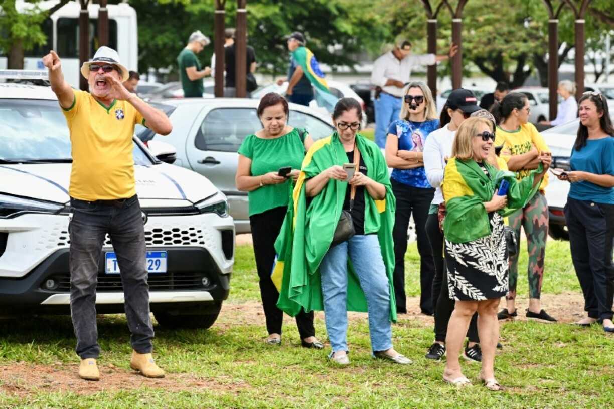 Supporters of former Brazilian president Jair Bolsonaro gathered outside the police headquarters where he is being held