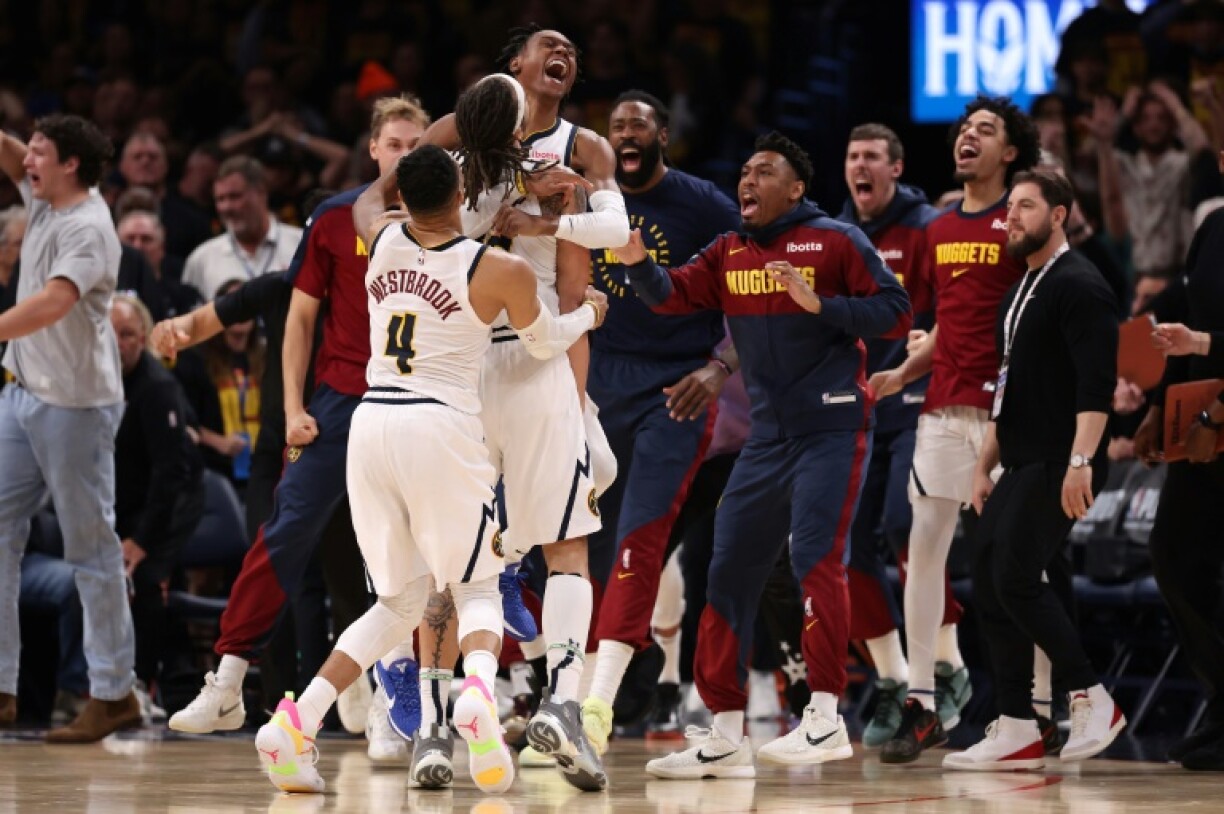 Denver's Aaron Gordon is mobbed by team-mates after his winning three-pointer in a victory over the Oklahoma City Thunder