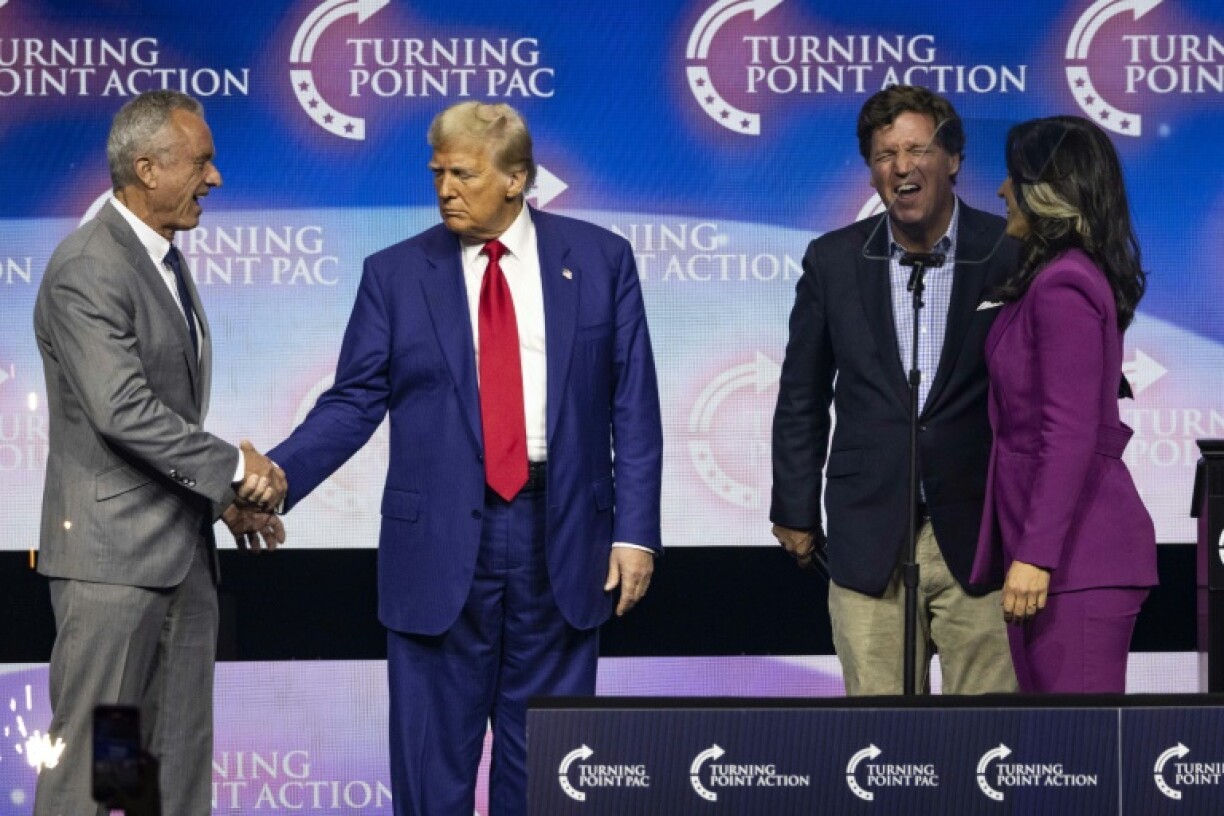 US President-elect Donald Trump (2nd L) has picked some controversial Cabinet nominees, including Robert F. Kennedy Jr (L) and former US congresswoman Tulsi Gabbard (R)