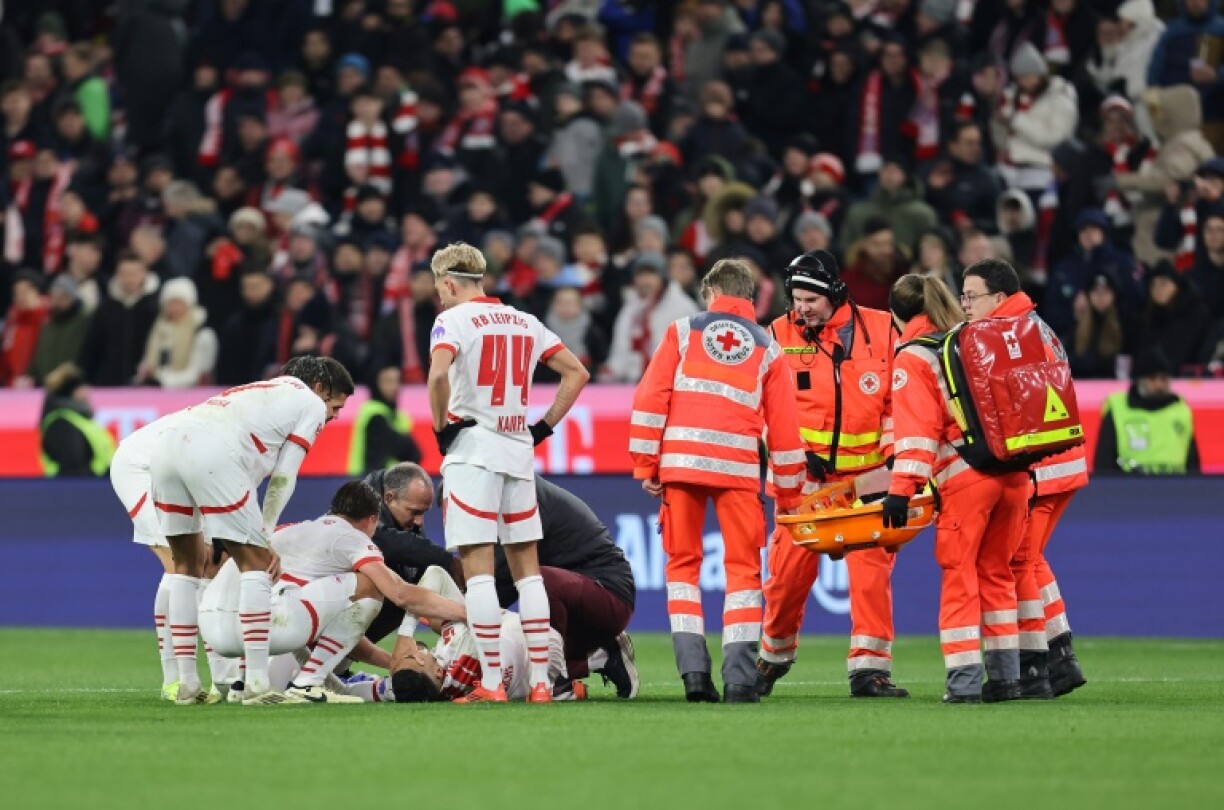 Benjamin Henrichs lies injured on the pitch against Bayern Munich in December