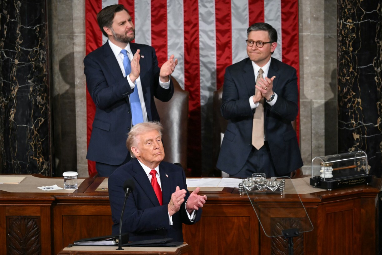 US President Donald Trump applauds as US veteran Captain E. Royce Williams receives the Medal of Honor during the State of the Union address in the House Chamber of the US Capitol in Washington, DC, on 24 February 2026.