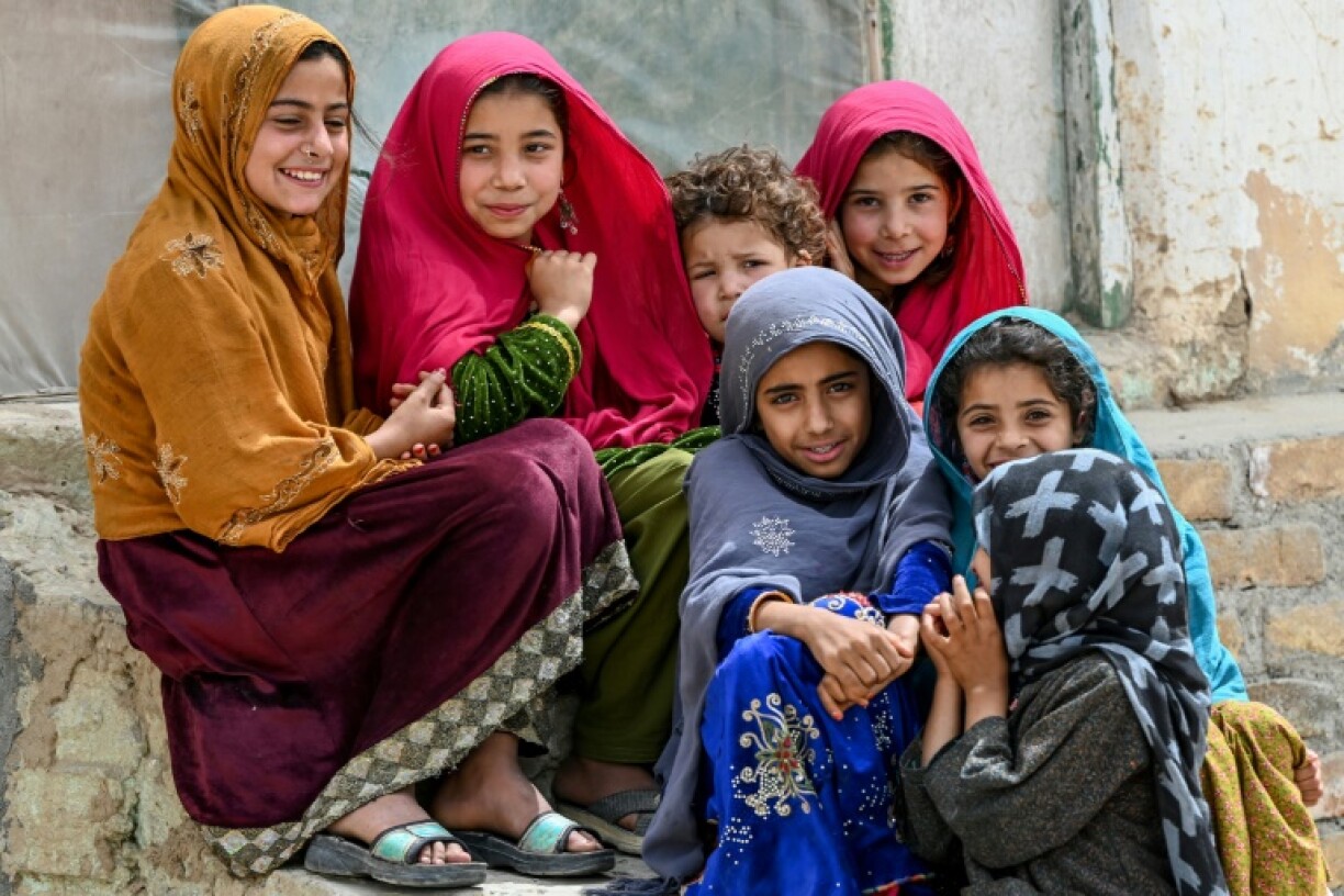 Afghan girls gather as Tom Fletcher arrives for a visit