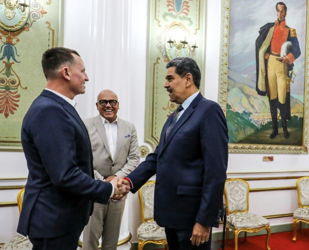 Venezuelan President Nicolas Maduro (R) met US envoy Richard Grenell in Caracas on January 31