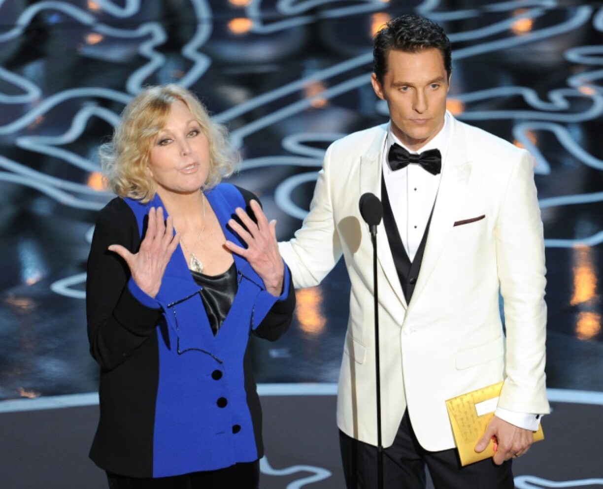 Kim Novak, pictured alongside Matthew McConaughey at the 2014 Oscars, played the chilling dual role of suicidal blonde Madeleine Elster and brunette shop girl Judy Barton in 'Vertigo'