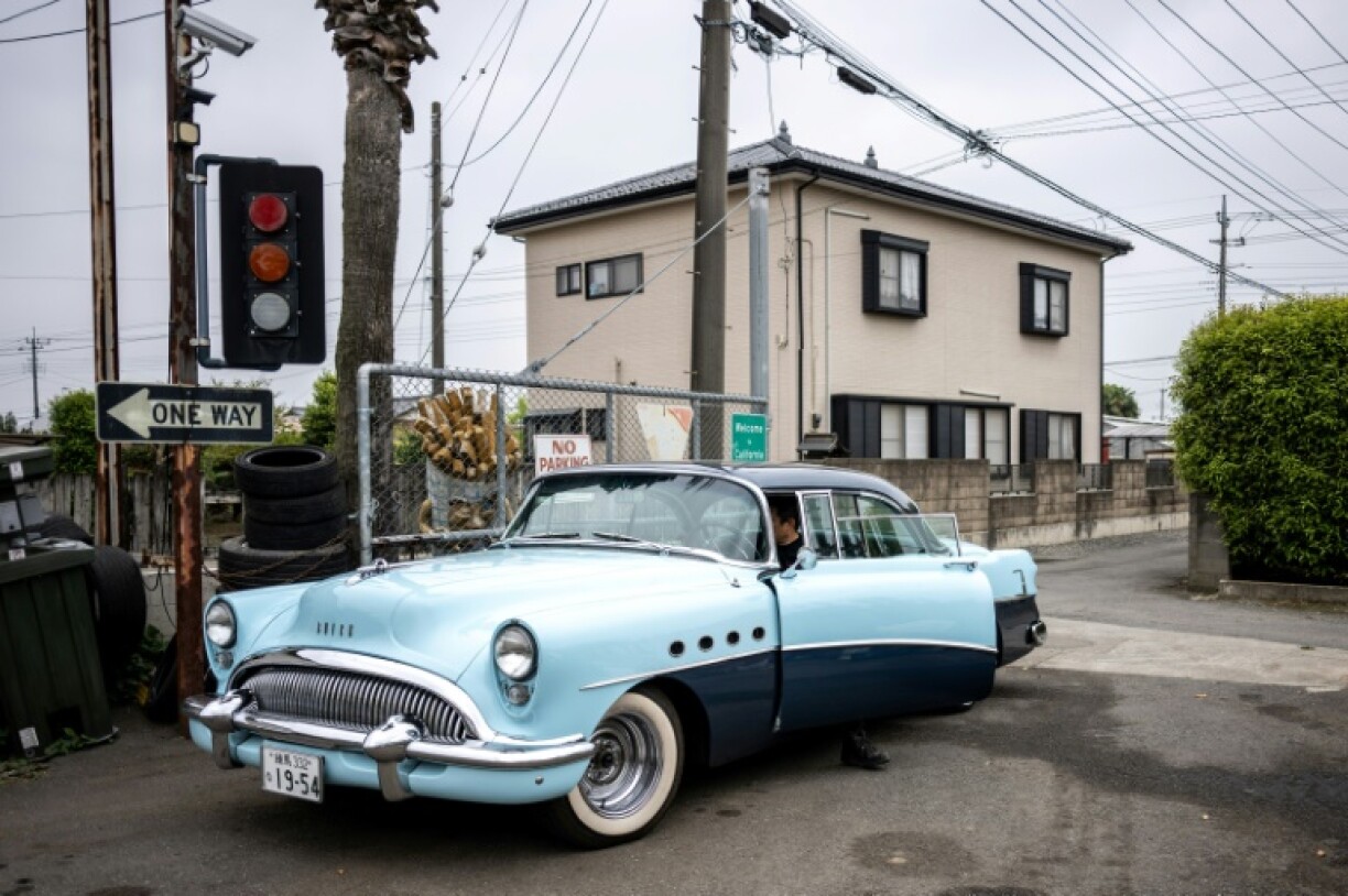 Yosuke Fukuda, the owner of US car dealer Y-Tech, sits in a 1954 Buick Roadmaster in Fukaya of Saitama Prefecture