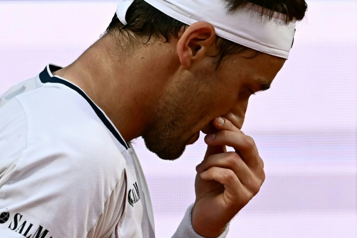 Casper Ruud was beaten in straight sets in just over an hour by Jannik Sinner.