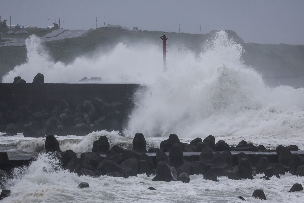 Waves crash against concrete wave breakers along the coast as Typhoon Champi approaches Taiwan, in Keelung on October 23, 2026. (Photo by I-HWA CHENG / AFP)