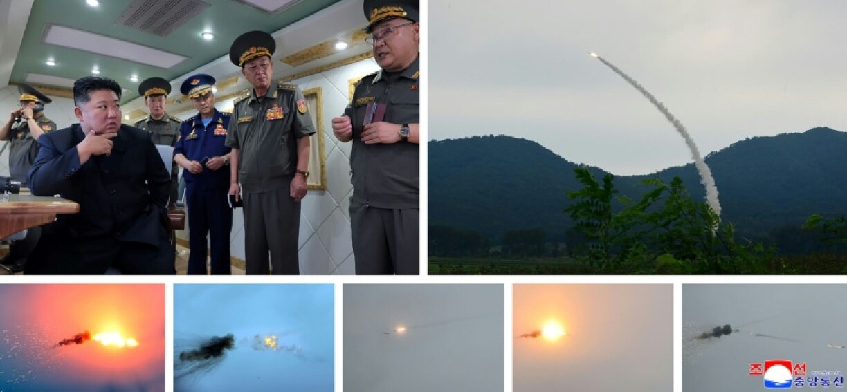 A combination picture released by North Korean state media shows Kim Jong Un inspecting the firing of new air defence missiles