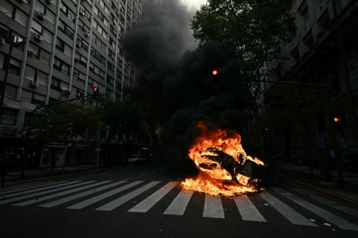 A patrol car and garbage cans were set on fire and several streets barricaded with debris at a protest march in support of Argentine pensioners