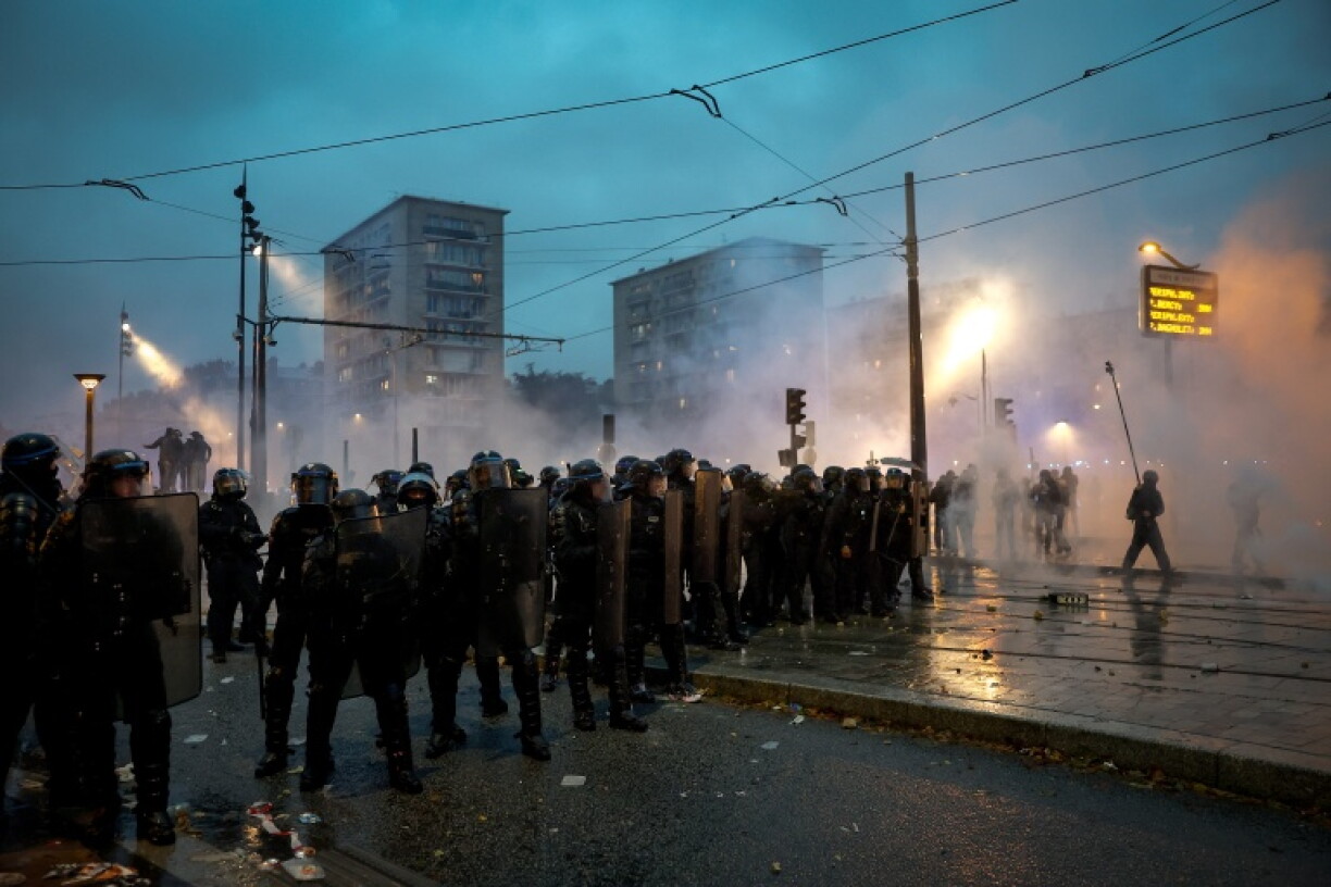 Police clashed for two hours with protesters in Paris after a demonstration over the cost of living dispersed