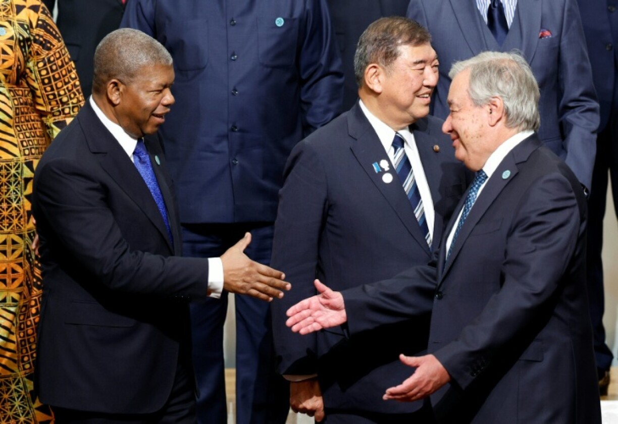 Angolan President Joao Lourenco (L) greets UN Secretary-General Antonio Guterres (R) during the 9th Tokyo International Conference on African Development in Japan