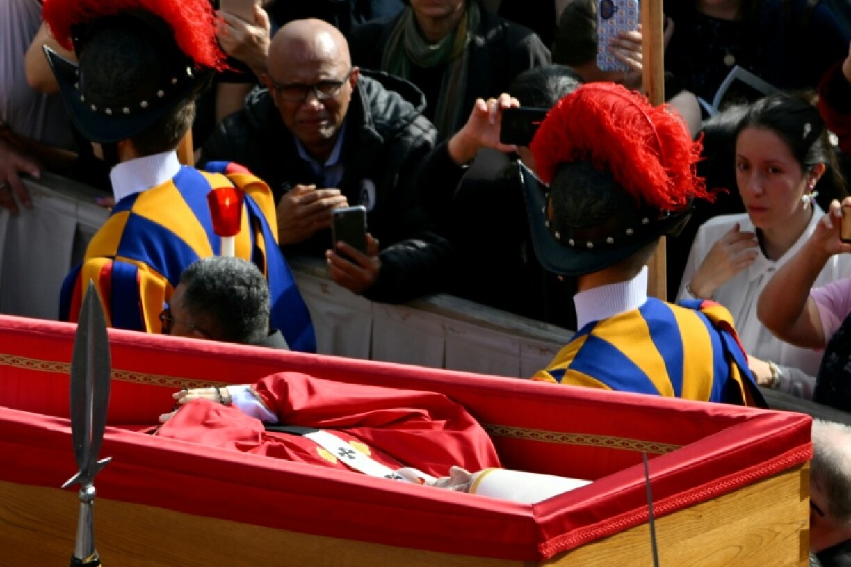 Pallbearers, next to Swiss Guards, carried the coffin of Pope Francis as it was transported from the chapel of Santa Marta to St Peter's Basilica