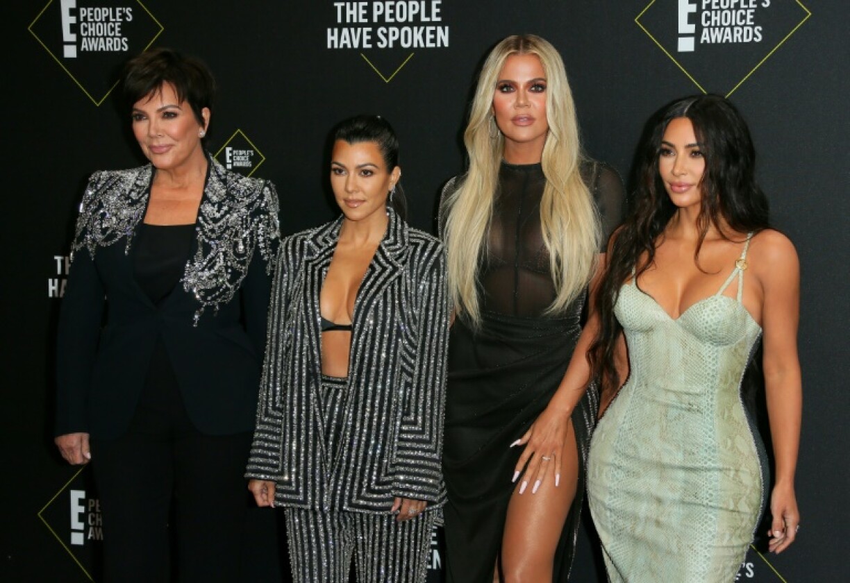 Kim Kardashian (R) found huge fame with (L-R) her 'momager' Kris Jenner and sisters Kourtney and Khloe Kardashian on their family reality show