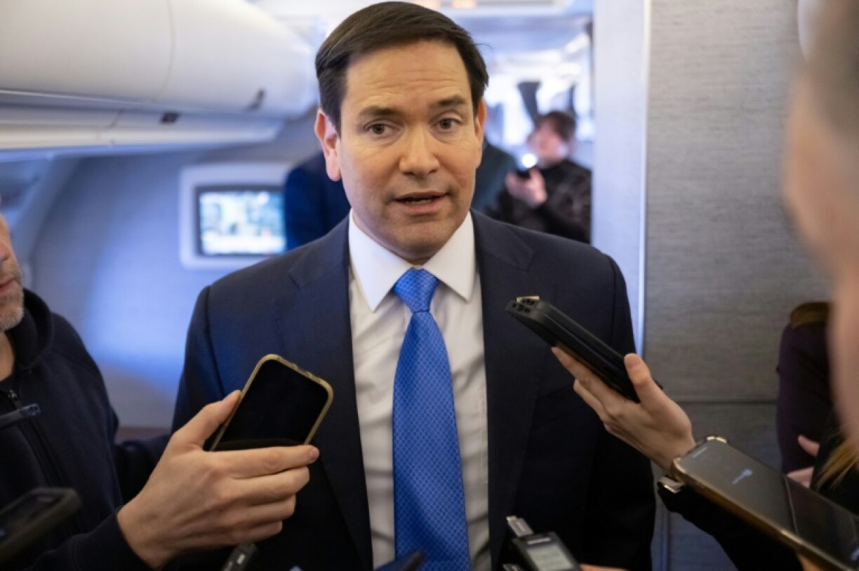 US Secretary of State Marco Rubio speaks with the media on his airplane as he flies to Jeddah, Saudi Arabia