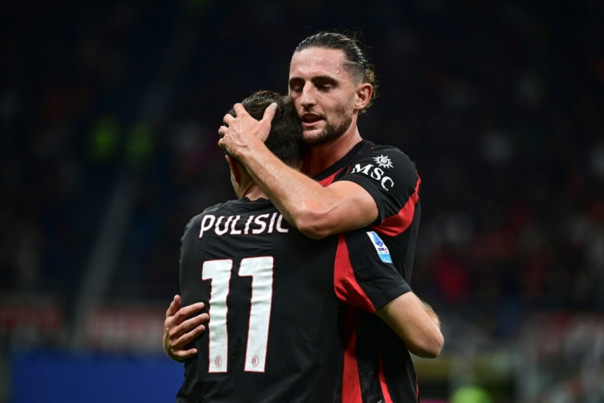 Adrien Rabiot celebrates Christian Pulisic's goal for AC Milan against Napoli