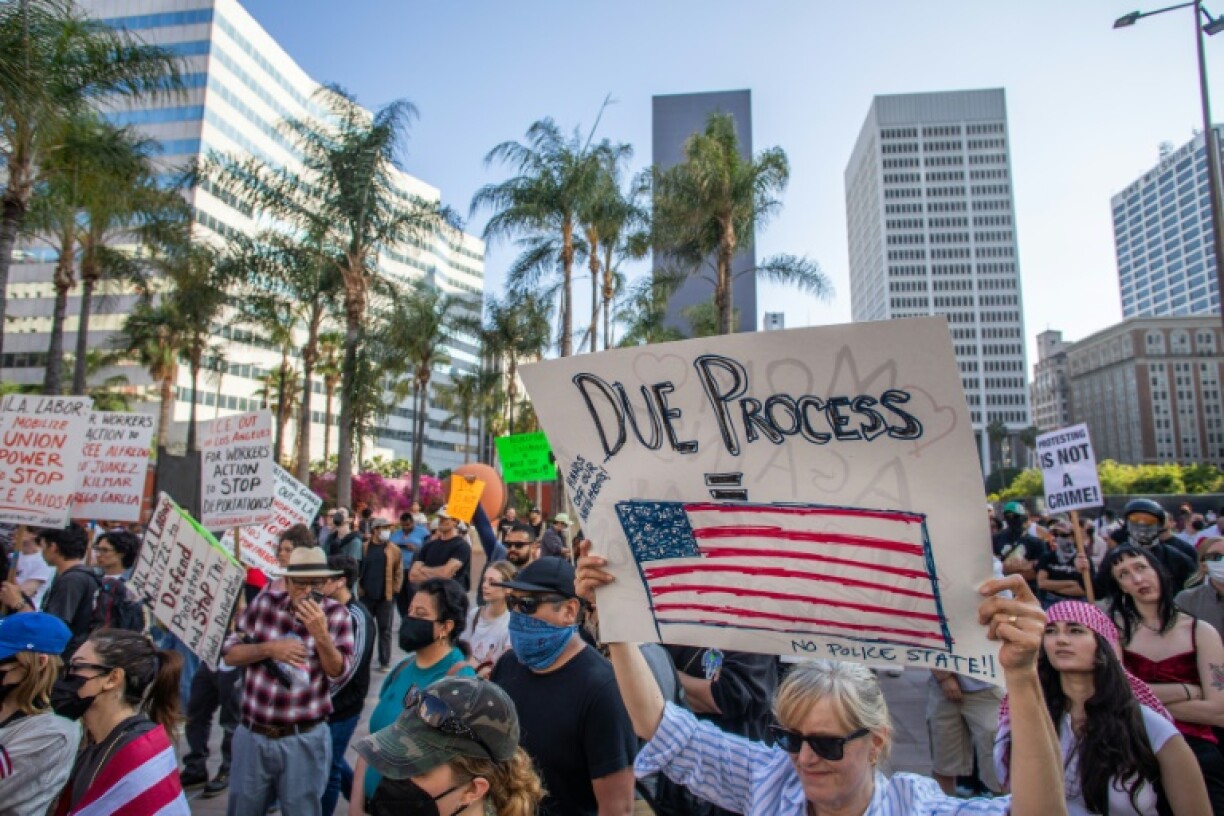 Over 1,000 people massed in America's second biggest city for a sixth day of protests, with the crowd peaceful as they marched through the streets