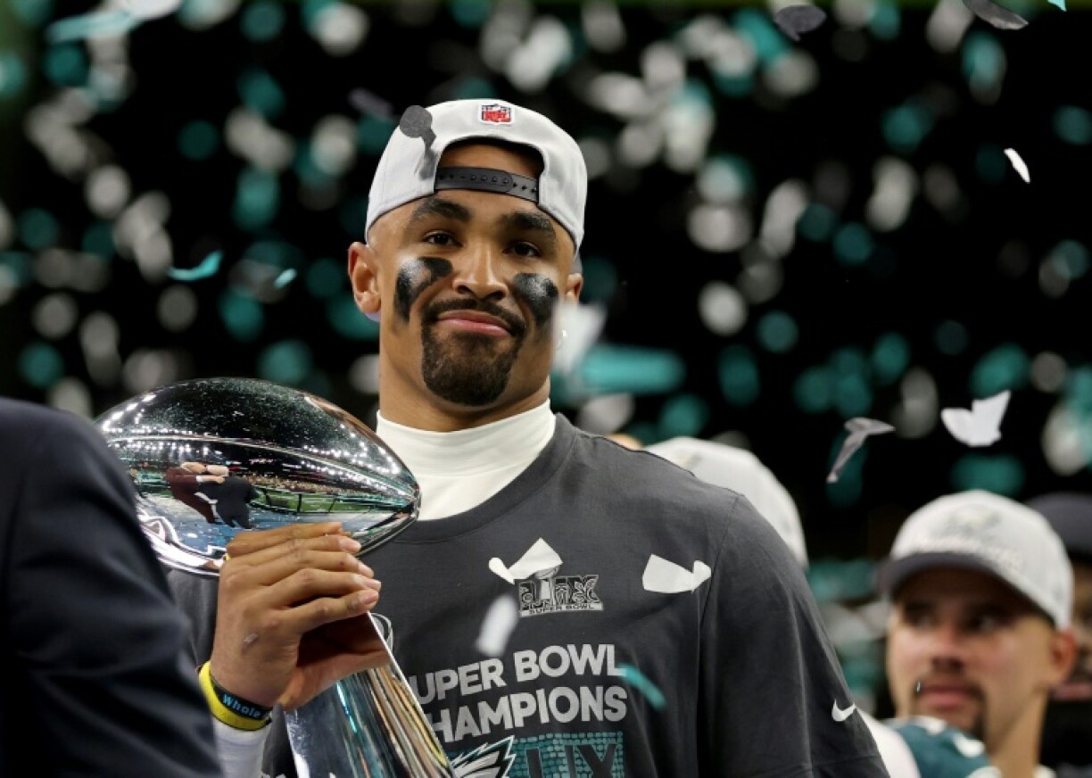 Super Bowl Most Valuable Player Jalen Hurts of the Philadelphia Eagles celebrates with the NFL championship trophy after a victory over the Kansas City Chiefs