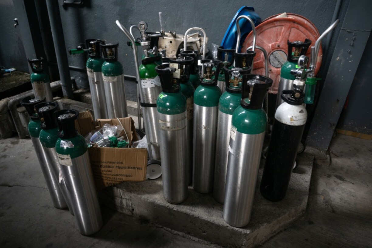 Oxygen tanks are seen as they await to be refilled at a medical supply warehouse in Kuala Lumpur on October 15, 2026