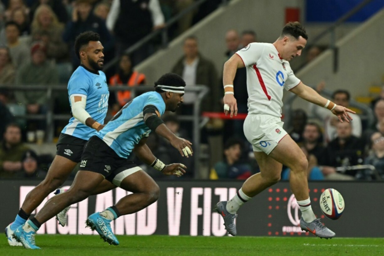 England's Henry Arundell (R) on his way to scoring a try during a 38-18 Autumn Nations Series win over Fiji at Twickenham