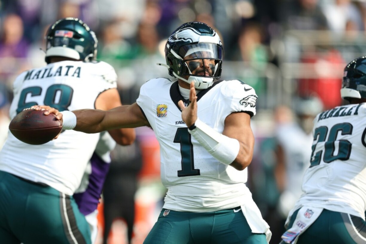 Philadelphia's Jalen Hurts threw for 326 yards and three touchdowns to spark the reigning NFL champion Eagles to a 28-22 triumph at Minnesota