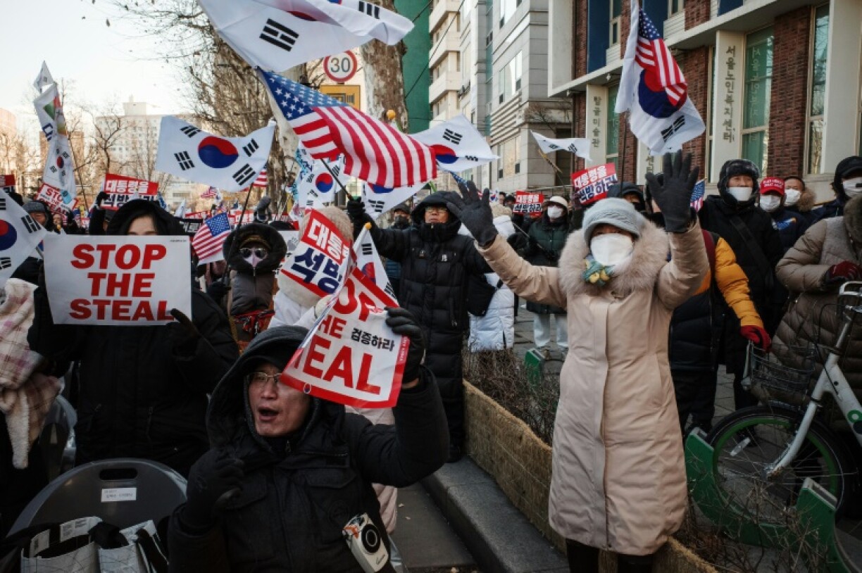 Supporters of South Korea's suspended President Yoon Suk Yeol attend a rally on a road near the Constitutional Court in Seoul