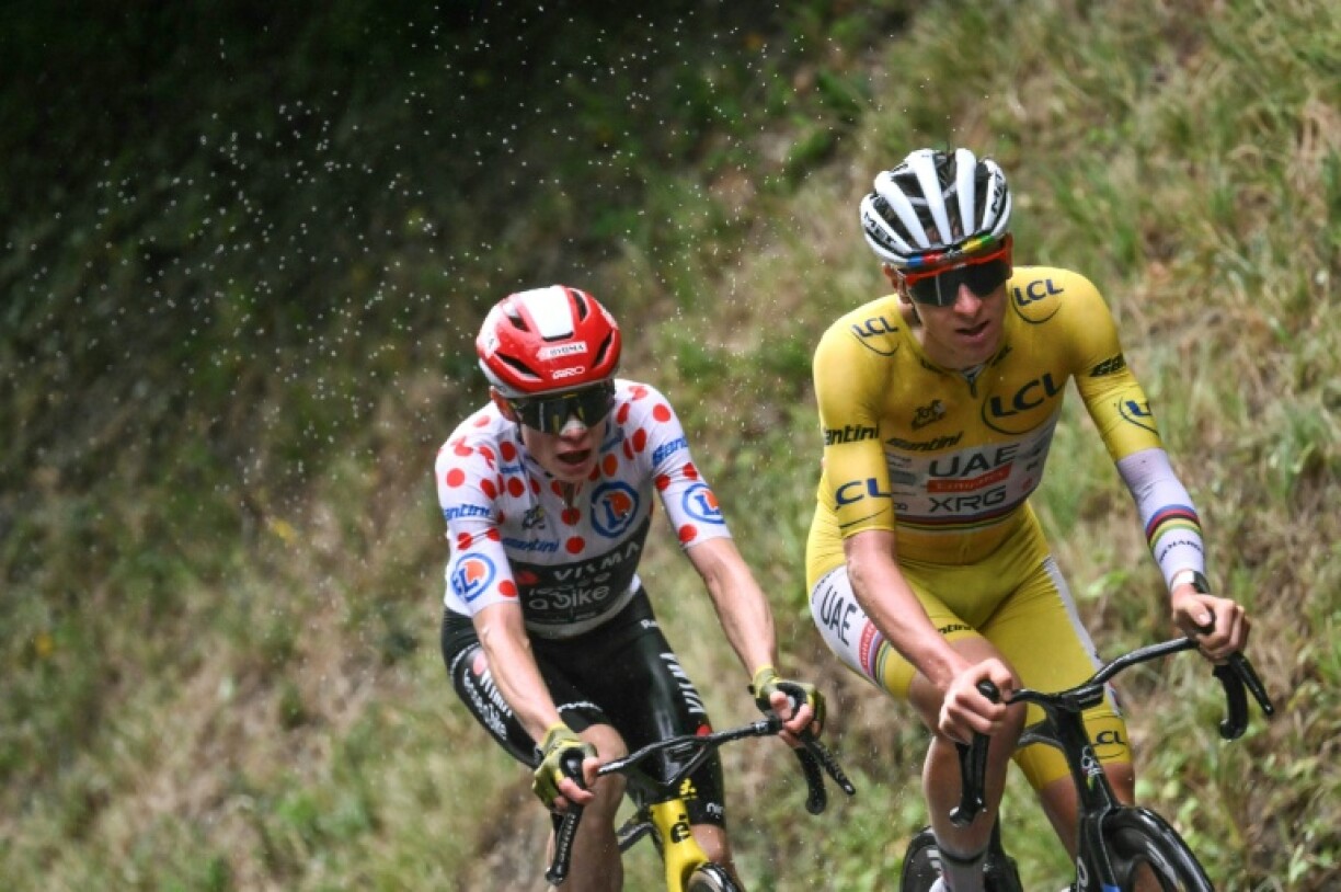Tadej Pogacar wearing the overall leader's yellow jersey and Danish rider Jonas Vingegaard arrive in Paris Sunday