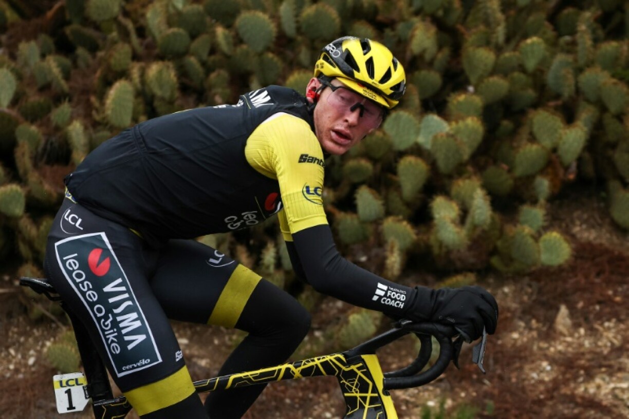 American race-leader Matteo Jorgenson wearing a wind breaker over his yellow jersey