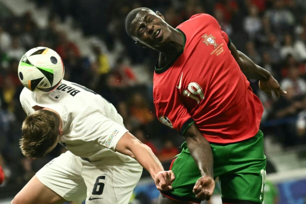 Slovenia defender Jaka Bijol (left) has joined Leeds