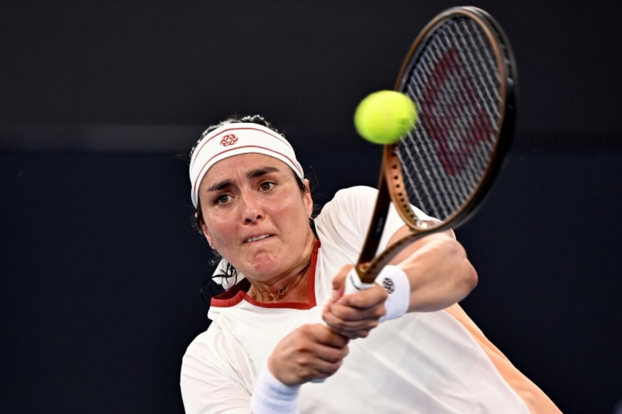 Ons Jabeur of Tunisia hits a return in the Brisbane quarter-finals