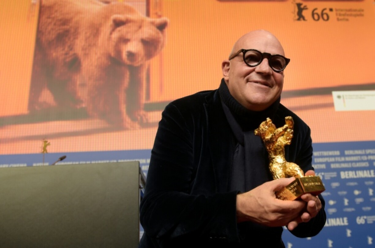 Rosi poses with his Golden Bear trophy for Best Film for