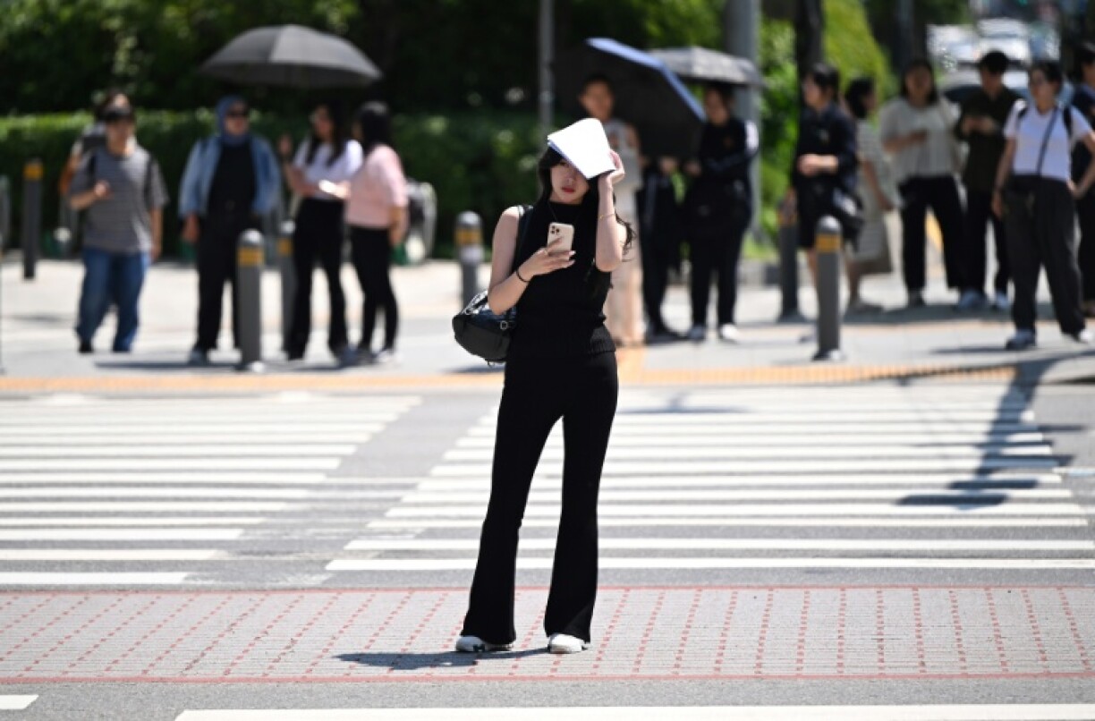 A streak of super-hot tropical nights broke a century-old South Korean weather record, according to official data, as the peninsula bakes in a prolonged heat wave
