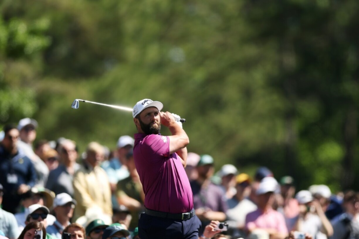 Former Jon Rahm of Spain plays a shot during a practice round before the 2025 Masters at Augusta National Golf Club