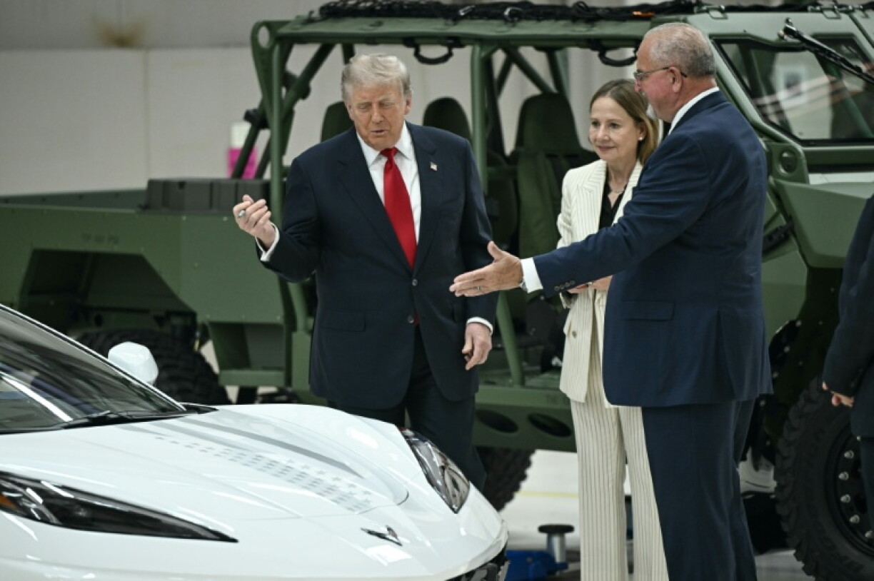 GM CEO Mary Barra (center) and GM Senior Vice President Ken Morris (R) hosted US President Donald Trump in July in a visit to Detroit
