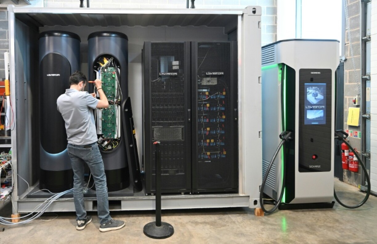 An engineer works on a flywheel energy storage system at Levistor's workshop in southwest London