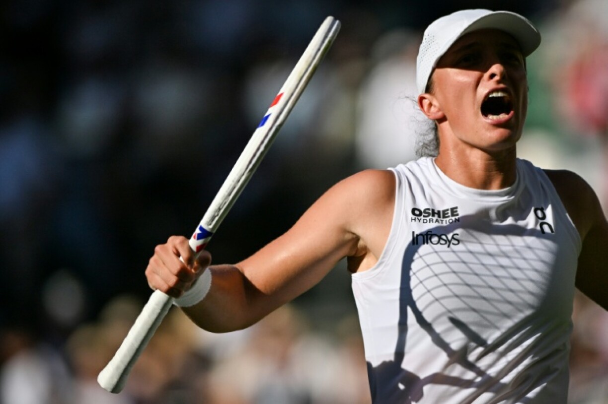 Poland's Iga Swiatek celebrates after reaching her first Wimbledon final