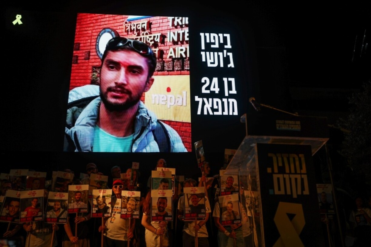 A picture of Nepalese national Bipin Joshi held hostage by Palestinian militants in Gaza since 2023, is displayed on a screen during a demonstration organised by the families of hostages calling for action to secure their release in Tel Aviv on August 16, 2025