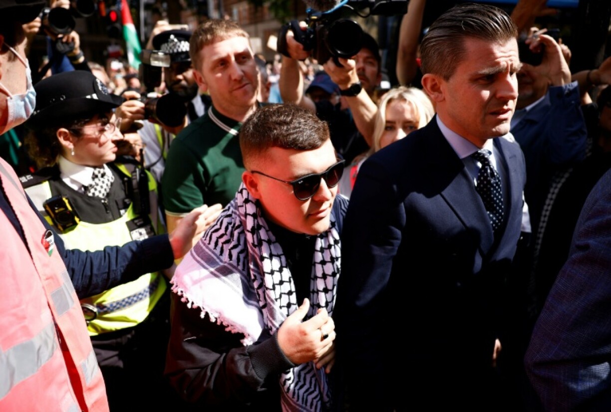 Kneecap rapper Liam O'Hanna, who uses the stage name Mo Chara, arrives at court wearing a Palestinian keffiyeh scarf