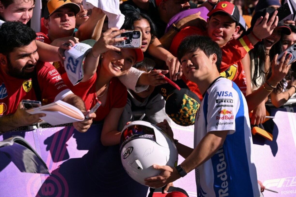 Yuki Tsunoda poses for photographs in Melbourne