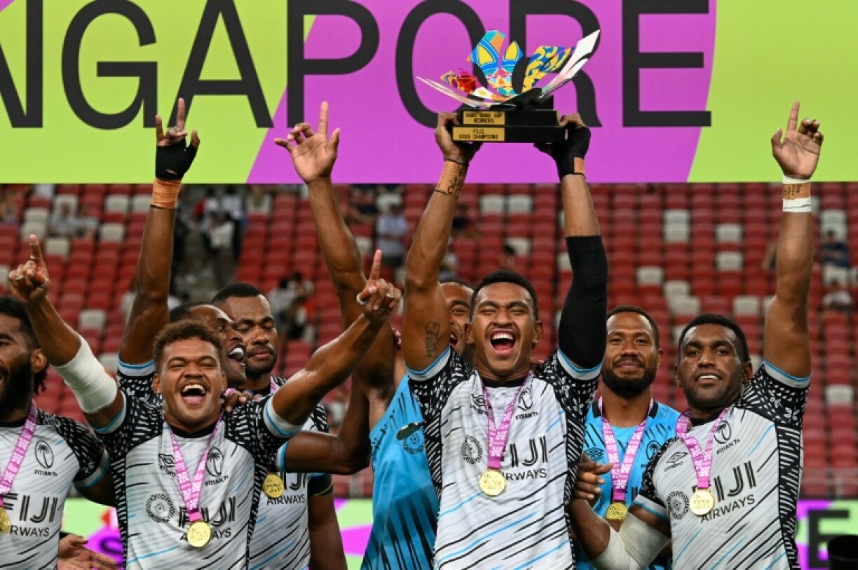 Fiji celebrates after winning the men's cup final against Kenya at the Rugby Sevens in Singapore