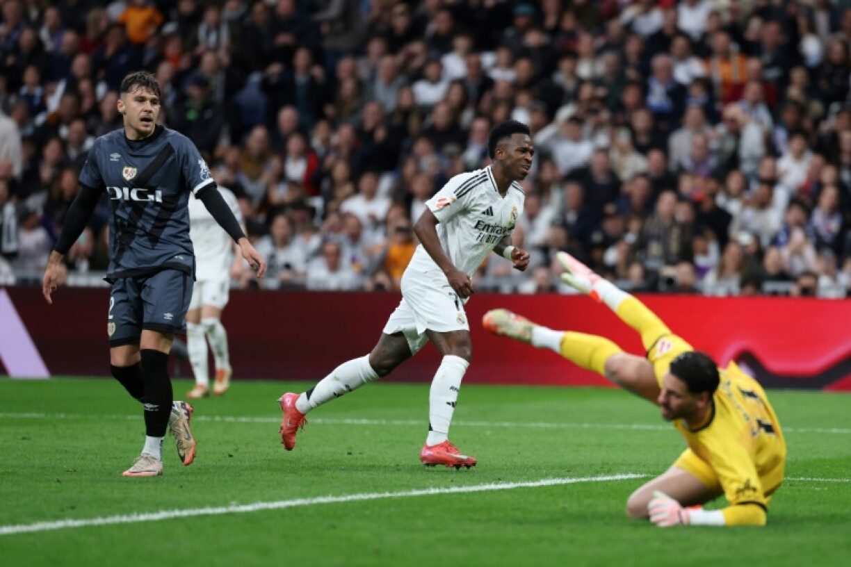 Real Madrid's Brazilian forward Vinicius Junior (C) celebrates scoring his team's second goal against Rayo Vallecano
