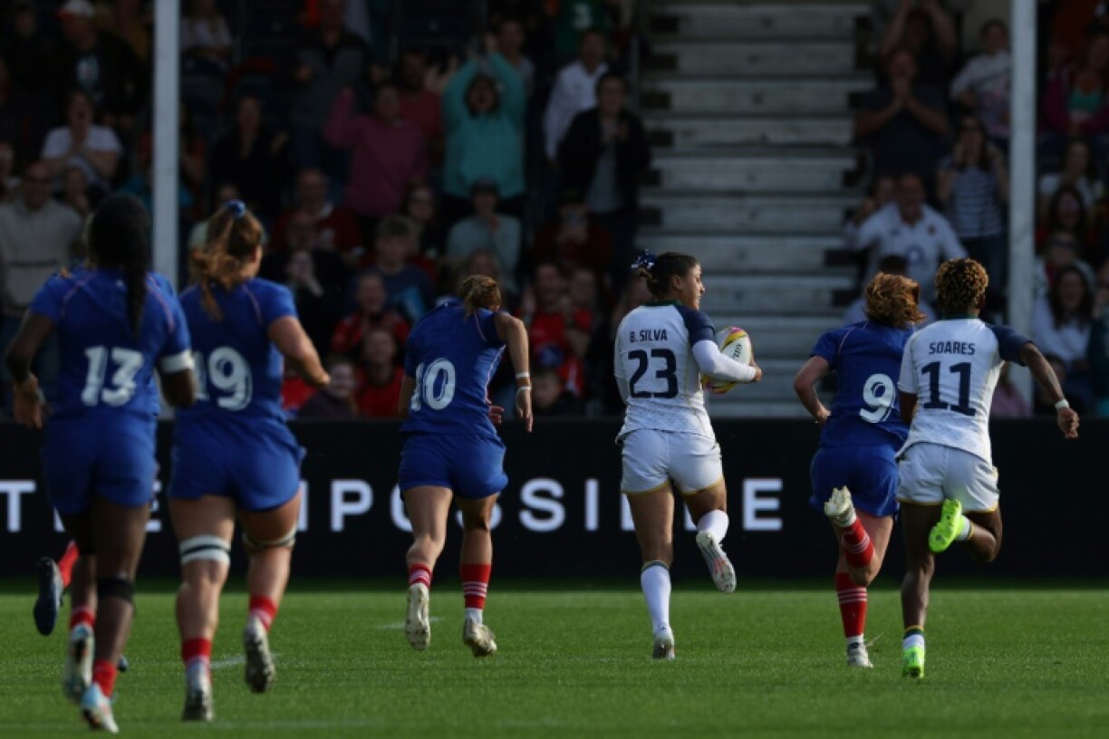 Brazil's Bianca Silva runs away to score their first try at a Women's Rugby World Cup during an 84-5 Pool D loss to France in Exeter
