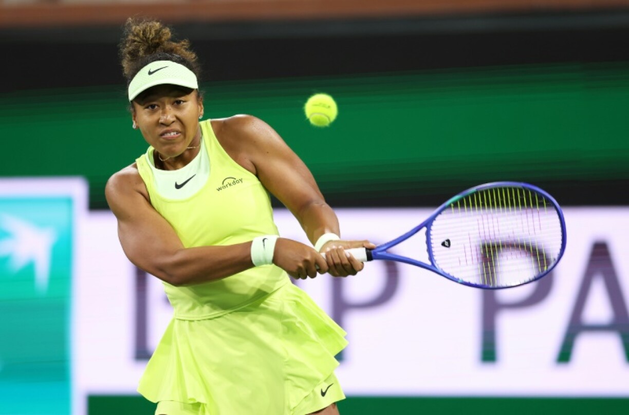 Naomi Osaka of Japan plays a backhand in her first-round loss to Camila Osorio at Indian Wells